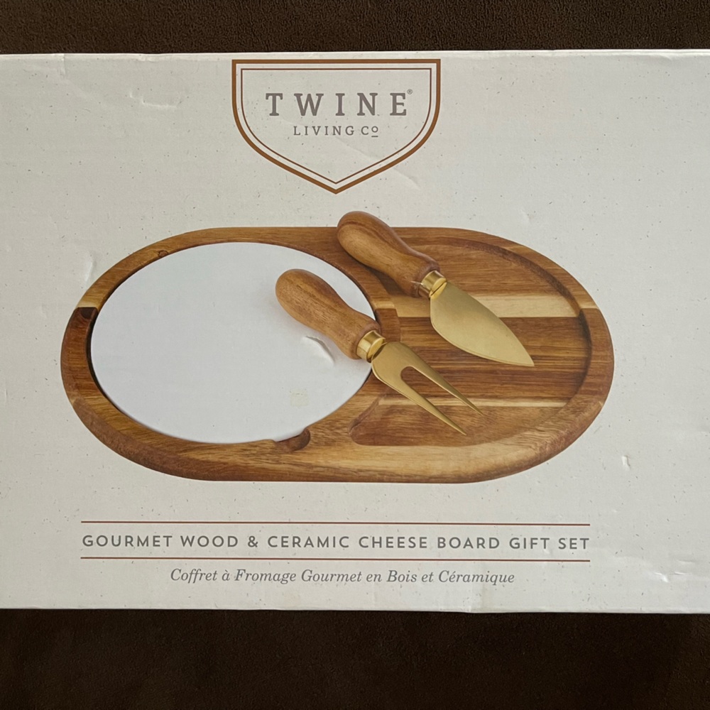 NWOT. Gourmet wood and ceramic cheese board and knives. Unopened. Never used.